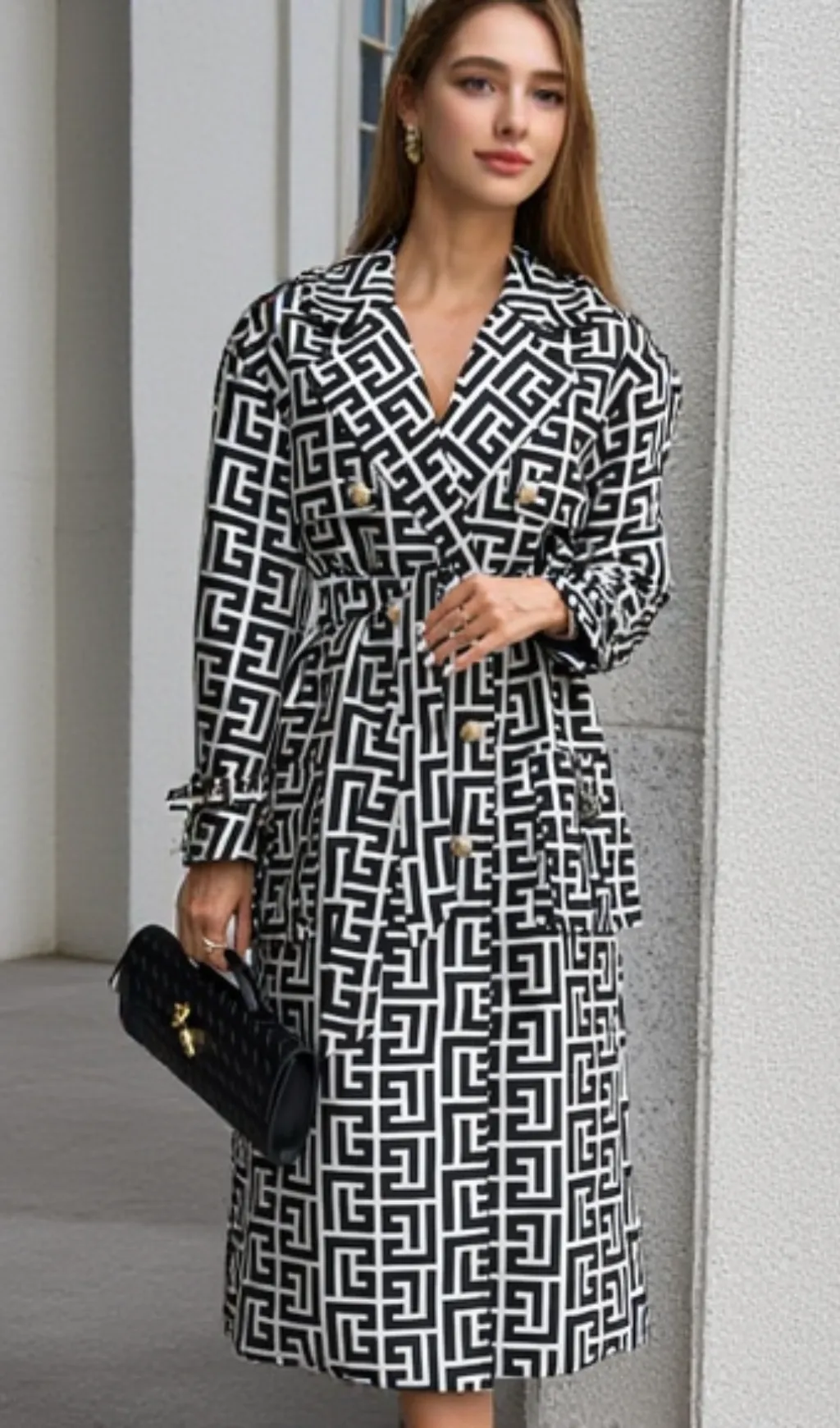 black monogrammed trench coat