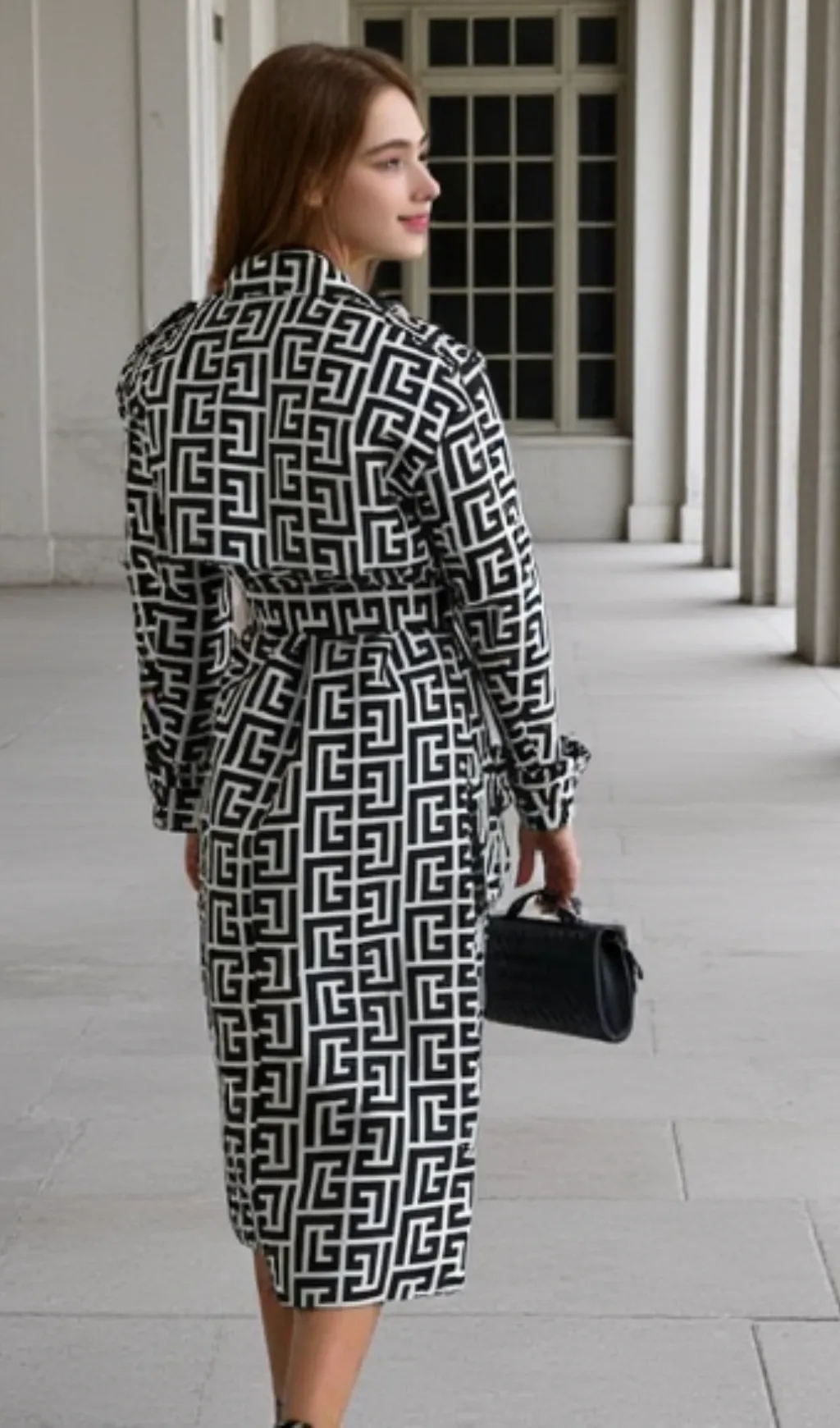 black monogrammed trench coat